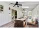 Relaxing sunroom with neutral furniture, a vaulted ceiling, and sliding glass doors to the backyard at 10432 Camelback Cir, Charlotte, NC 28226