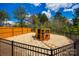 Fenced backyard with a wooden chicken coop and wood-chip groundcover at 1079 Sage Pine Cir, Clover, SC 29710