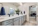 Bathroom featuring double sinks with a gray vanity and quartz countertops at 1079 Sage Pine Cir, Clover, SC 29710