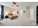 Bedroom with desk, map, and dark wood furniture in a well-lit, spacious room at 1079 Sage Pine Cir, Clover, SC 29710