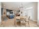 Dining area adjacent to kitchen, featuring a large round table and natural light at 1079 Sage Pine Cir, Clover, SC 29710