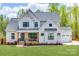 Charming two-story home features a welcoming front porch, well-manicured lawn, and a two-car garage at 1079 Sage Pine Cir, Clover, SC 29710