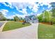 Beautiful home showcasing a well-manicured lawn and a paved driveway at 1079 Sage Pine Cir, Clover, SC 29710