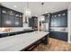 Modern kitchen features navy cabinets, marble countertops, and stainless steel appliances at 1079 Sage Pine Cir, Clover, SC 29710