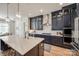 Beautiful kitchen with navy cabinets, stainless steel appliances, and a large center island at 1079 Sage Pine Cir, Clover, SC 29710