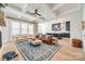 This living room boasts an open layout, coffered ceilings, and large windows for natural light at 1079 Sage Pine Cir, Clover, SC 29710