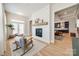Comfortable living room featuring a fireplace with white shiplap and stylish rocking chairs at 1079 Sage Pine Cir, Clover, SC 29710