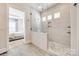 Modern main bathroom with glass-enclosed shower and decorative tile accents at 1079 Sage Pine Cir, Clover, SC 29710