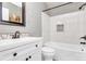 Beautifully renovated bathroom features a modern vanity, white tile bathtub and updated fixtures at 110 Shamrock Ne St, Concord, NC 28025