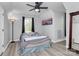 Cozy bedroom featuring a comfortable full-sized bed, soft lighting, and neutral decor at 110 Shamrock Ne St, Concord, NC 28025