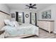 Bright bedroom with a queen-sized bed, stylish decor, and large windows offering natural light at 110 Shamrock Ne St, Concord, NC 28025