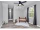 bedroom filled with natural light features a decorative crib and soft, neutral tones at 110 Shamrock Ne St, Concord, NC 28025