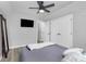 Spacious bedroom features gray carpet, ceiling fan and views into additional rooms at 110 Shamrock Ne St, Concord, NC 28025