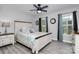Charming bedroom with a large window, ceiling fan, and a comfortable queen-sized bed at 110 Shamrock Ne St, Concord, NC 28025