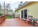 Exterior of the home shows sliding glass doors leading to an outdoor seating area on the deck at 110 Shamrock Ne St, Concord, NC 28025