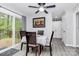 Cozy dining area features a modern table, wood chairs, a sliding glass door to the deck, and neutral decor at 110 Shamrock Ne St, Concord, NC 28025