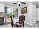 Cozy dining area features a modern table, wood chairs, a sliding glass door to the deck, and neutral decor at 110 Shamrock Ne St, Concord, NC 28025