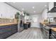 Modern kitchen featuring two-tone cabinets, wood countertops, stylish backsplash, and stainless steel appliances at 110 Shamrock Ne St, Concord, NC 28025