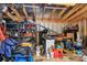 Interior of shed cluttered with tools and equipment. Shelving on left shows supplies at 110 Shamrock Ne St, Concord, NC 28025
