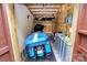 View of motorcycle parked in shed, with helmet shelf above. Walls are wood-framed at 110 Shamrock Ne St, Concord, NC 28025