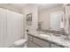 Neutral toned bathroom features a toilet, shower, and granite countertop at 11234 Smokethorn Nw Dr, Concord, NC 28027