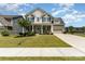 Charming two-story home featuring a welcoming front porch and a well-manicured lawn, perfect for curb appeal at 11234 Smokethorn Nw Dr, Concord, NC 28027