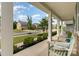 Inviting front porch with comfortable seating, perfect for relaxing and enjoying the neighborhood views at 11234 Smokethorn Nw Dr, Concord, NC 28027