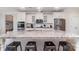 Spacious kitchen island with granite countertops, seating, and stainless steel appliances at 11234 Smokethorn Nw Dr, Concord, NC 28027