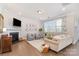 Bright living room with a fireplace, hardwood floors, and comfortable seating, creating a warm ambiance at 11234 Smokethorn Nw Dr, Concord, NC 28027