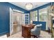 Well-appointed office with a classic desk, elegant decor, and a view of the main floor at 11234 Smokethorn Nw Dr, Concord, NC 28027