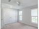 Bedroom showcasing large closets, carpet floors, and two windows with blinds at 12036 Duke Lancaster Dr, Charlotte, NC 28277