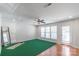 The sun filled bonus room leads to a patio with lots of light and a ceiling fan at 12036 Duke Lancaster Dr, Charlotte, NC 28277