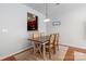 Cozy dining room with a wooden table, four chairs, and light fixture at 12036 Duke Lancaster Dr, Charlotte, NC 28277
