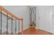 Charming townhome entryway with wood staircase and wrought iron details near the front door at 12036 Duke Lancaster Dr, Charlotte, NC 28277