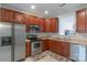 Galley kitchen offers stainless steel appliances, ample wood cabinets, and light countertops at 12036 Duke Lancaster Dr, Charlotte, NC 28277