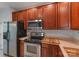 Well-equipped kitchen featuring stainless steel appliances, wooden cabinets, and laminate countertops at 12036 Duke Lancaster Dr, Charlotte, NC 28277