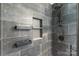 Modern tiled shower with a rainfall shower head, shelving and wall niche at 12036 Duke Lancaster Dr, Charlotte, NC 28277
