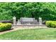Kingsley neighborhood entrance features a stone sign surrounded by lush landscaping at 12036 Duke Lancaster Dr, Charlotte, NC 28277