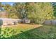 Backyard featuring mature trees, shed, patio perfect for outdoor entertaining at 1219 Century Dr, Clover, SC 29710