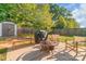 Backyard featuring mature trees, shed, and patio perfect for outdoor entertaining at 1219 Century Dr, Clover, SC 29710