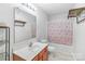 Bathroom featuring vanity, mirror, toilet and tub with cherry blossom patterned shower curtain at 1219 Century Dr, Clover, SC 29710