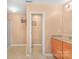 Bright bathroom with tile floors, a walk-in shower, and a wooden vanity with lots of storage space at 1219 Century Dr, Clover, SC 29710