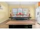 Bright dining room featuring a rustic table with chairs and bench seating at 1219 Century Dr, Clover, SC 29710