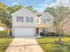 Charming two-story home with a well-manicured lawn and attached garage at 1219 Century Dr, Clover, SC 29710