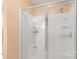 Bathroom featuring a glass-enclosed shower with built-in shelving and a shower head at 1219 Century Dr, Clover, SC 29710