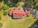 Aerial view of estate featuring manicured grounds, a driveway, and lush gardens at 1233 General Hoke Dr, Lincolnton, NC 28092