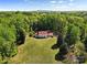 Areal view of a beautiful home surrounded by lush greenery and a well-manicured lawn at 1233 General Hoke Dr, Lincolnton, NC 28092