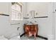 Vintage bathroom featuring elegant vanity, decorative gold fixtures, and black and white tile at 1233 General Hoke Dr, Lincolnton, NC 28092