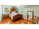 Cozy bedroom with hardwood floors, wood trim, and great natural lighting at 1233 General Hoke Dr, Lincolnton, NC 28092