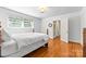 Bright bedroom with hardwood floors, double windows, and an ensuite bathroom view at 1233 General Hoke Dr, Lincolnton, NC 28092